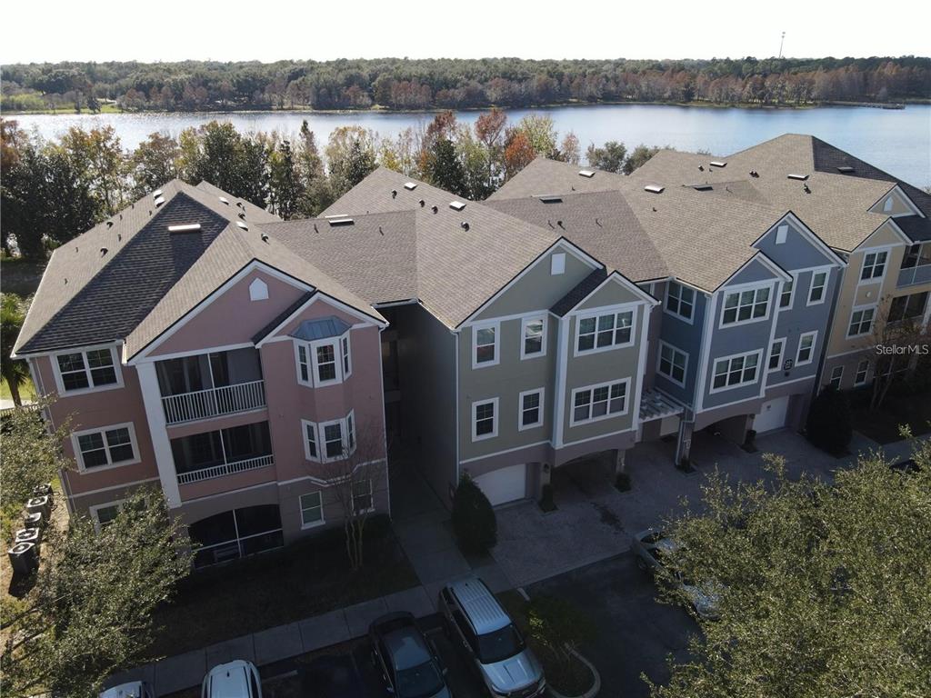 a aerial view of a house with a lake view