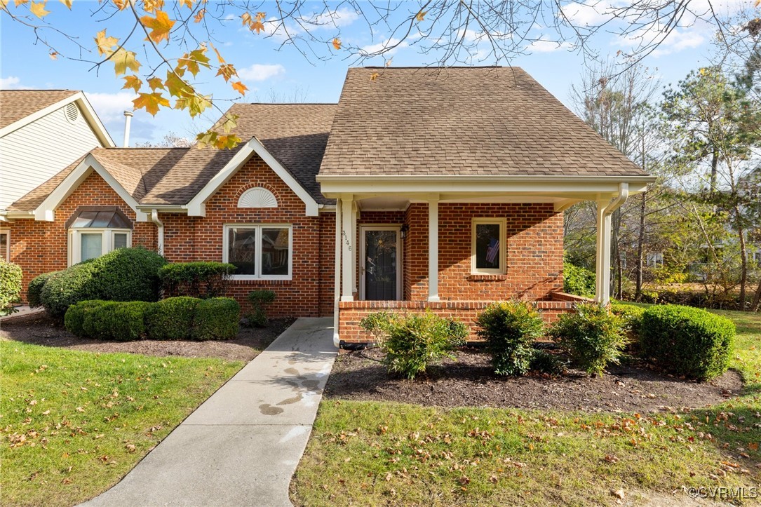 View of front of home with covered porch and a fro