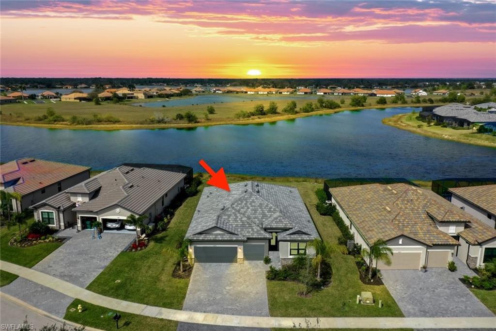 aerial view of a house with a lake view