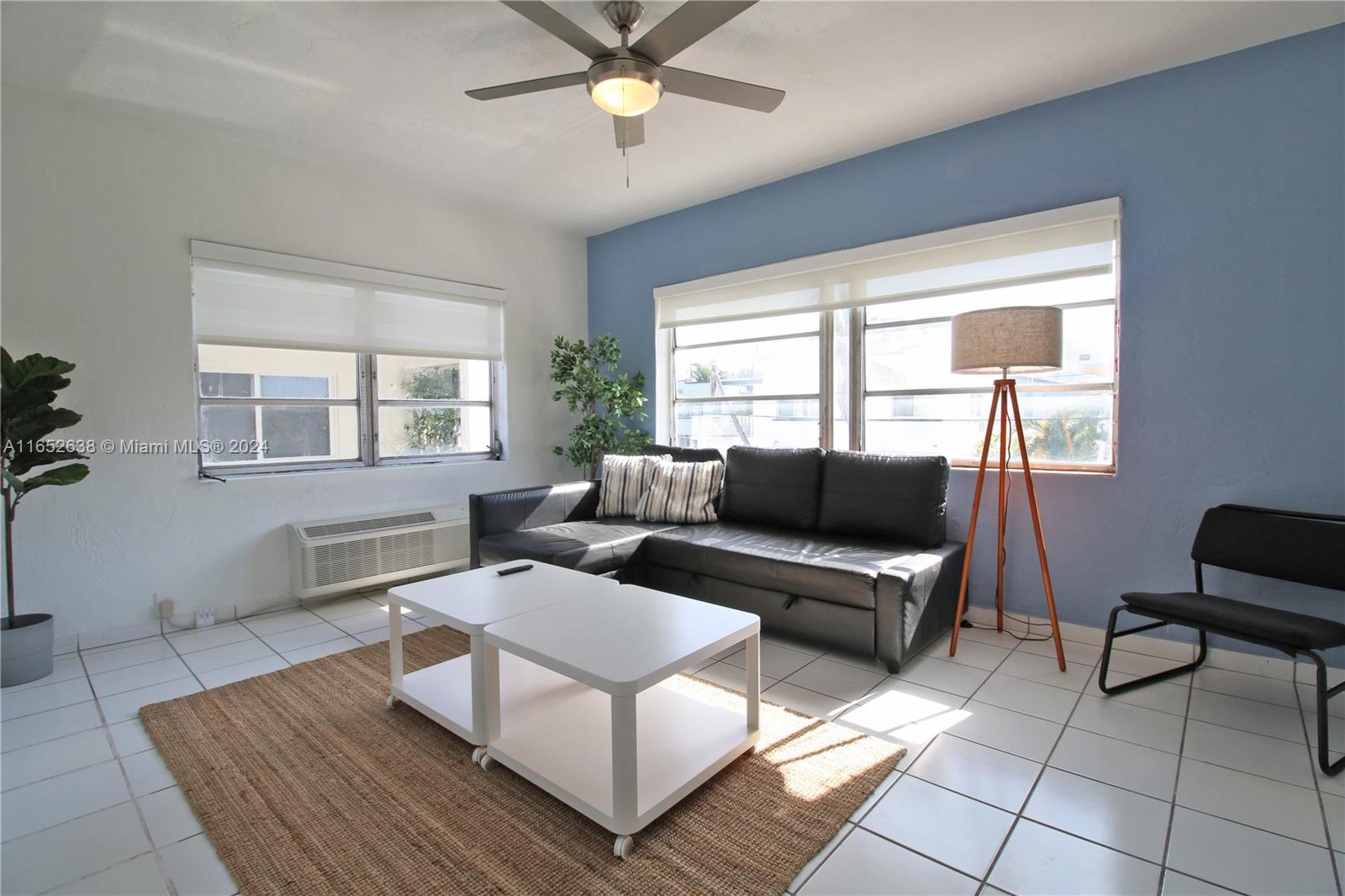 a living room with furniture and a window