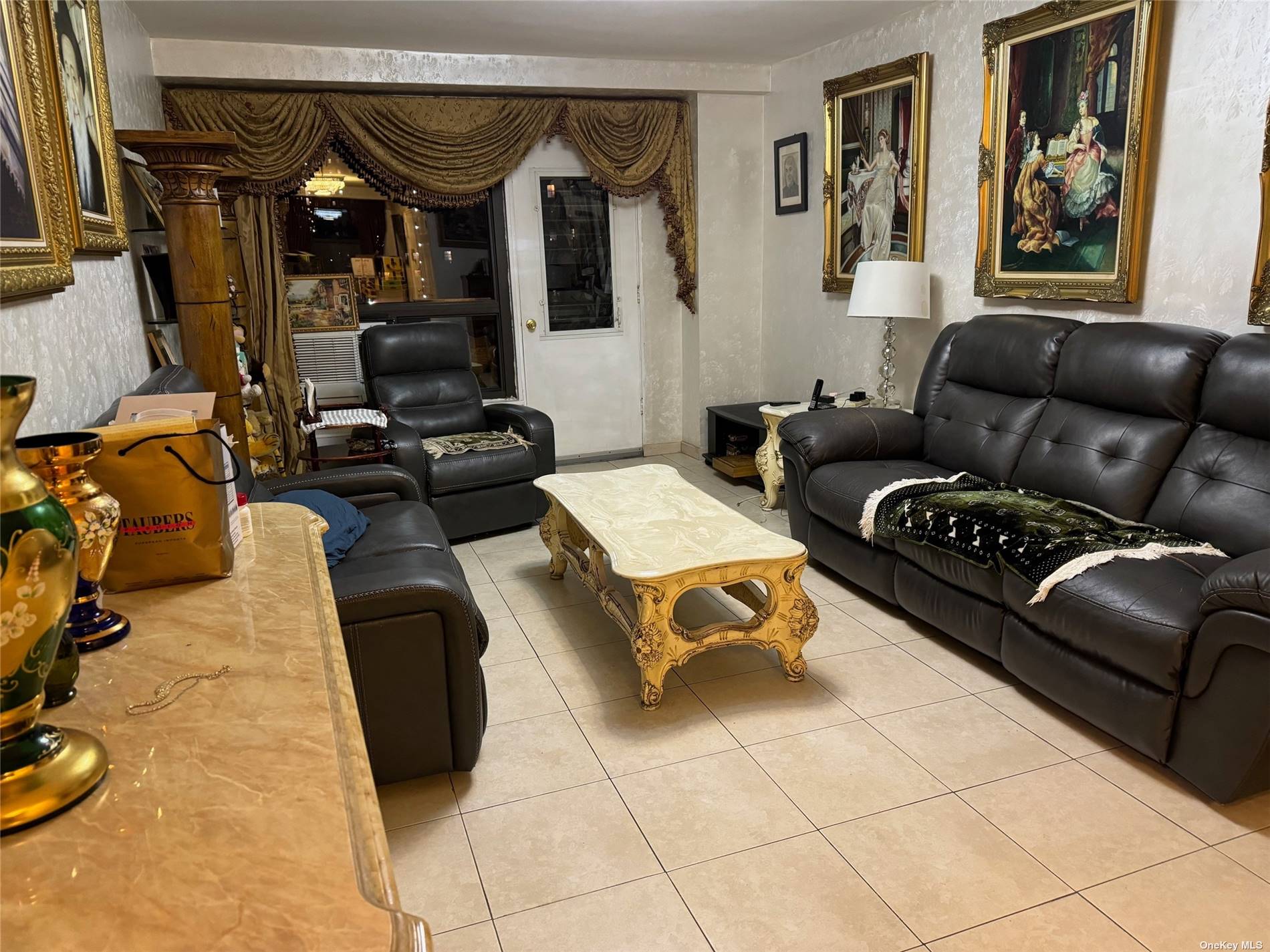 a living room with furniture a couch and a flat screen tv