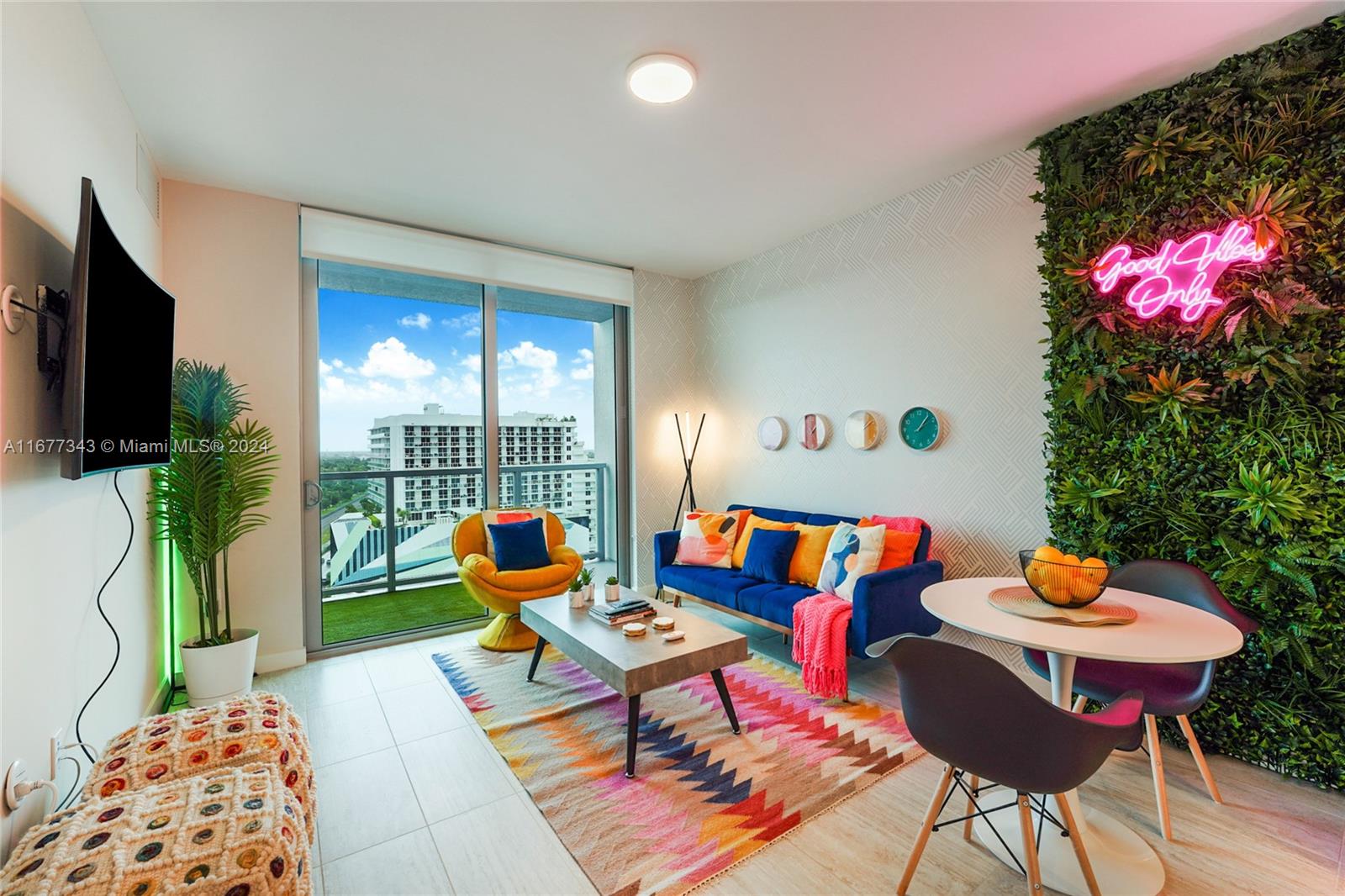 a living room filled with furniture and a potted plant