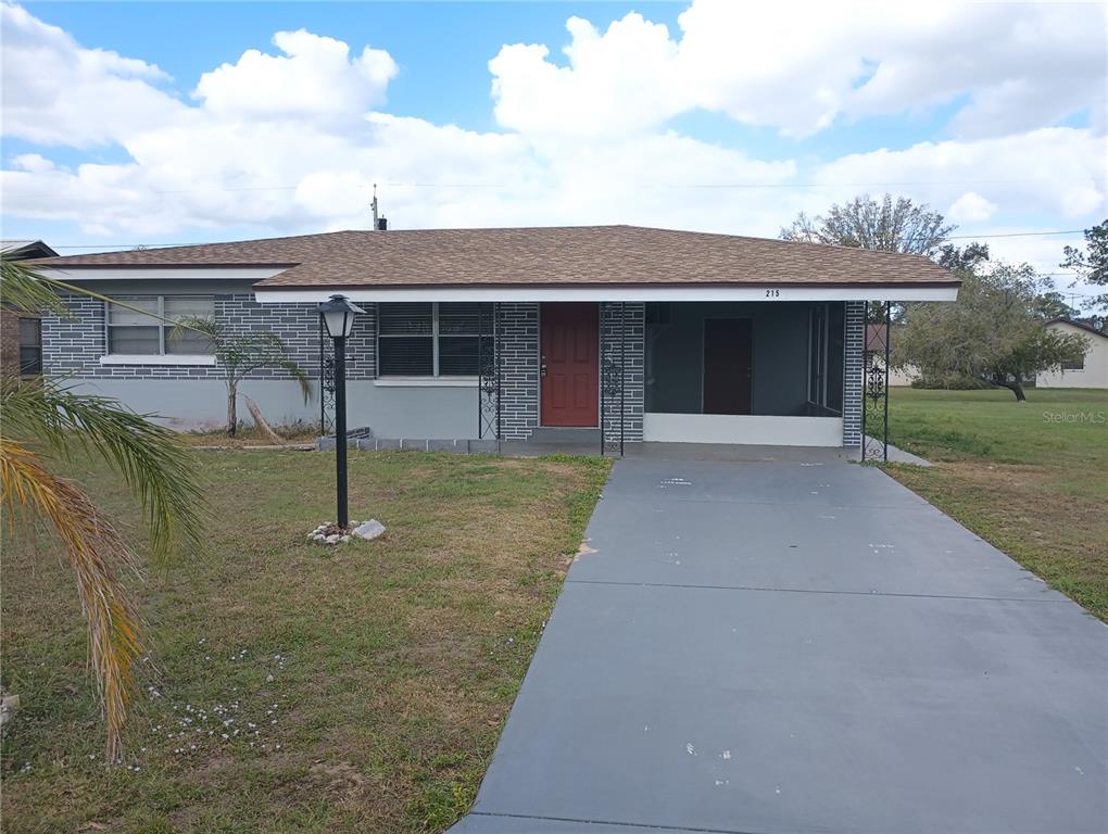 front view of a house with a yard