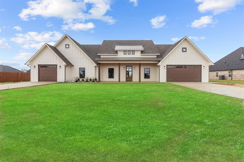 a big house with a big yard and large trees