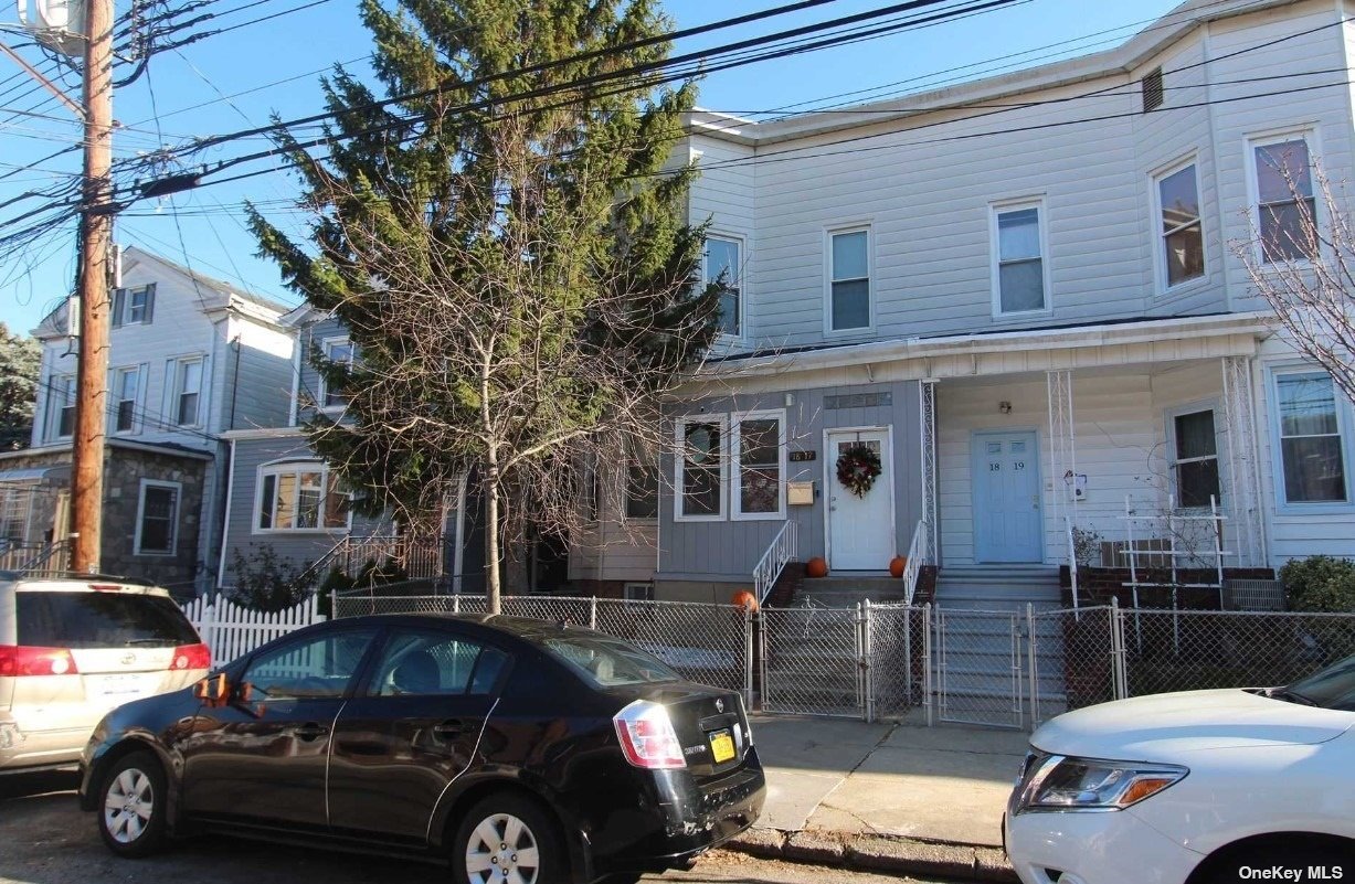 a front view of a house with parking space