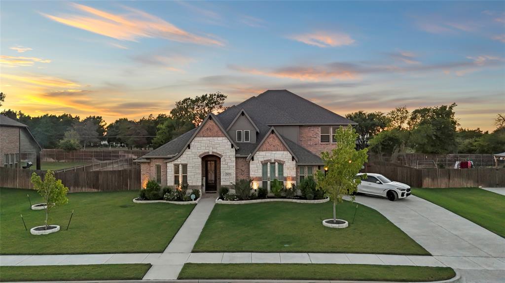 a front view of a house with a yard