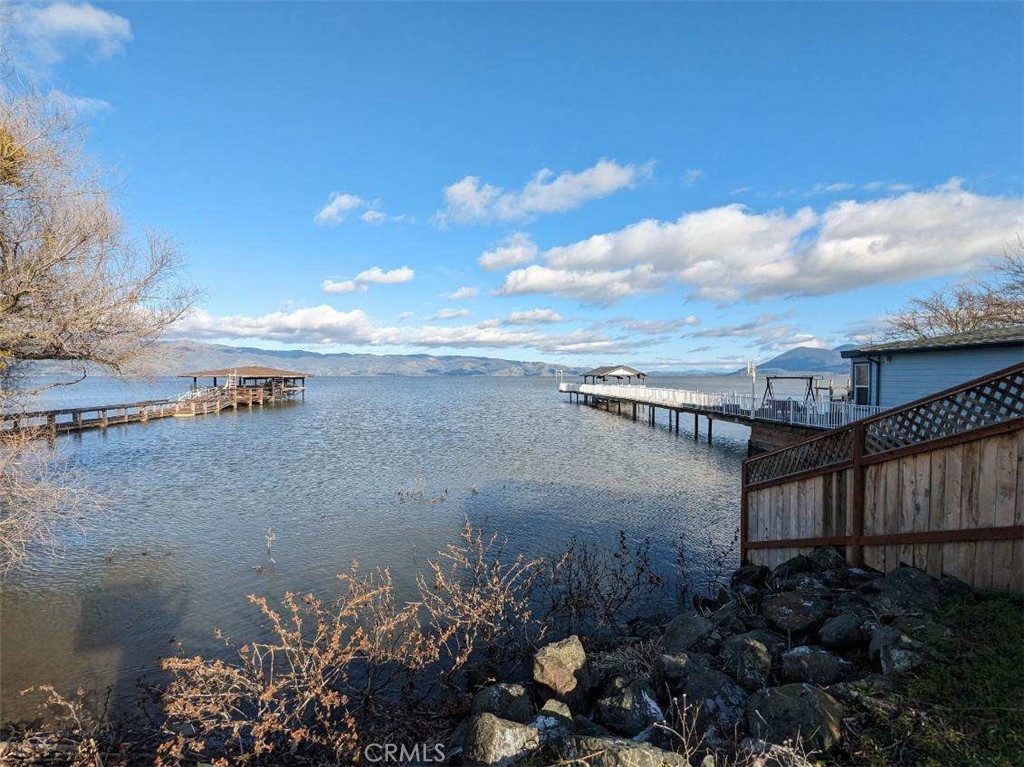 a view of a lake with sitting area