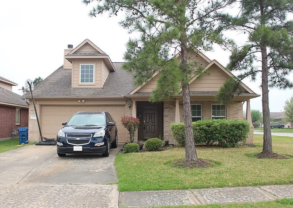 a car parked in front of a house