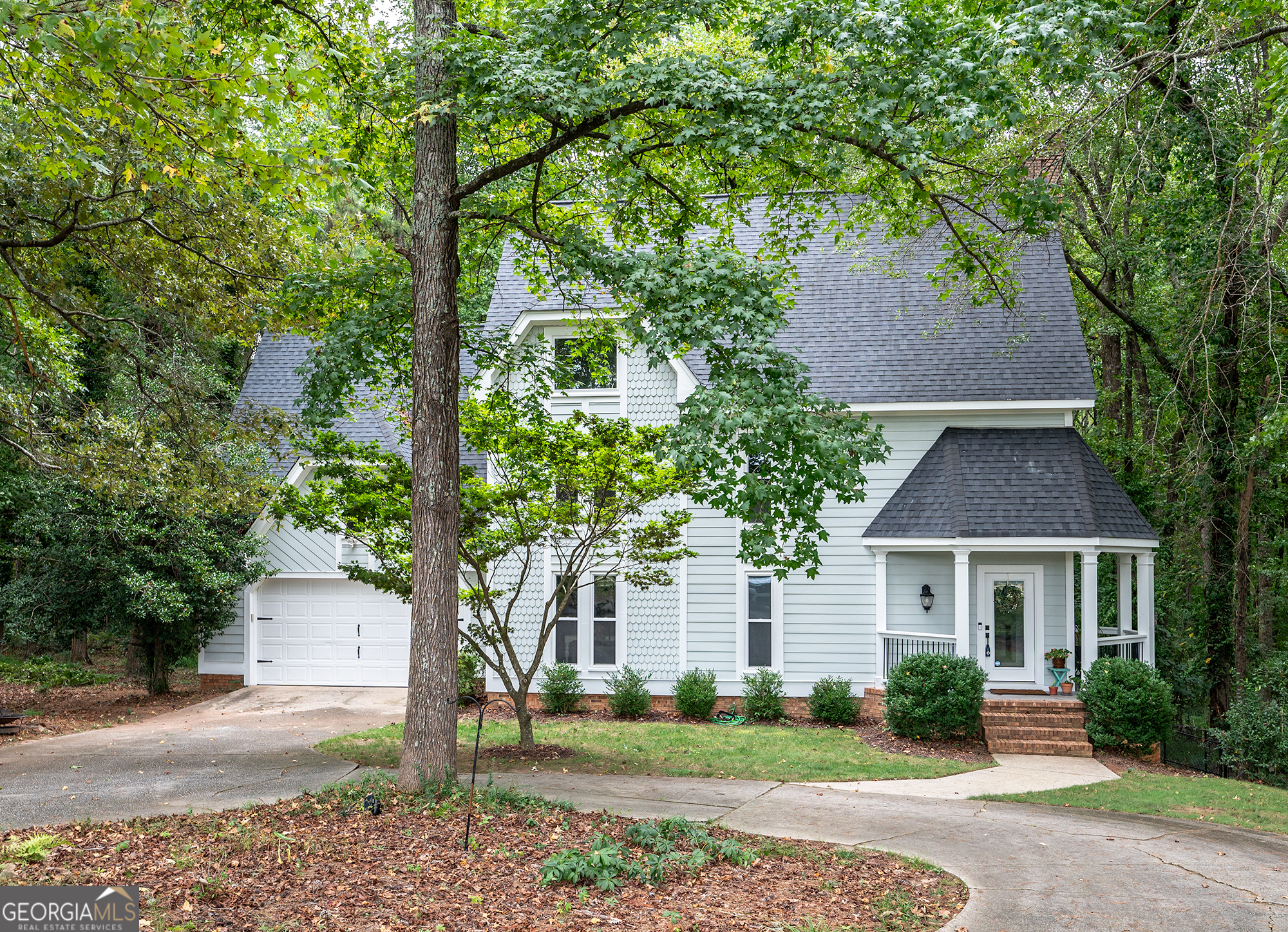 front view of a house with a yard