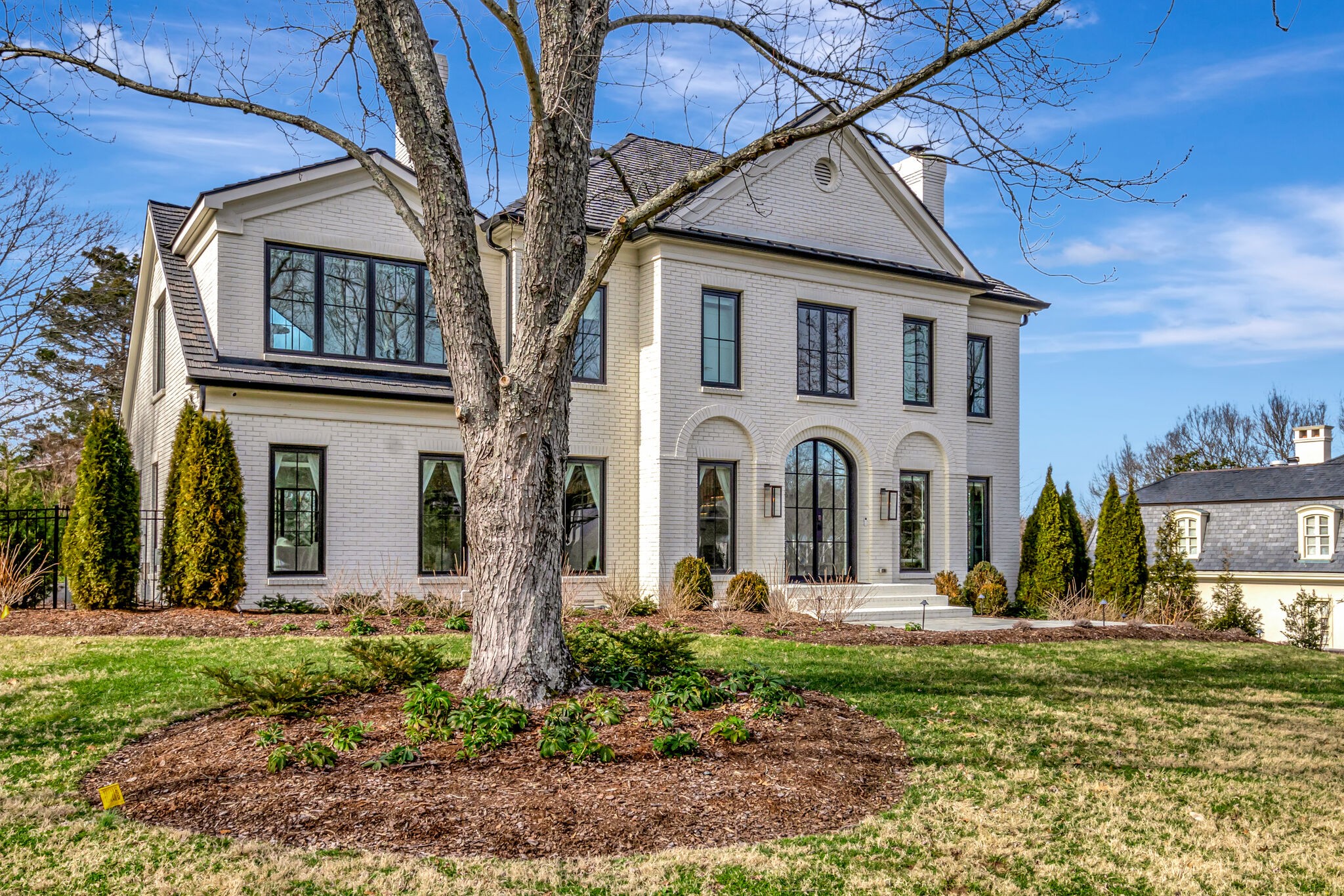 a front view of a house with garden