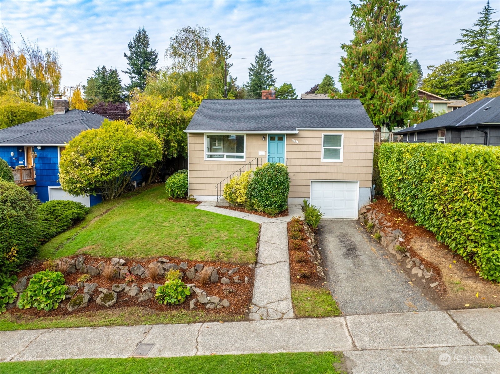 front view of a house with a yard