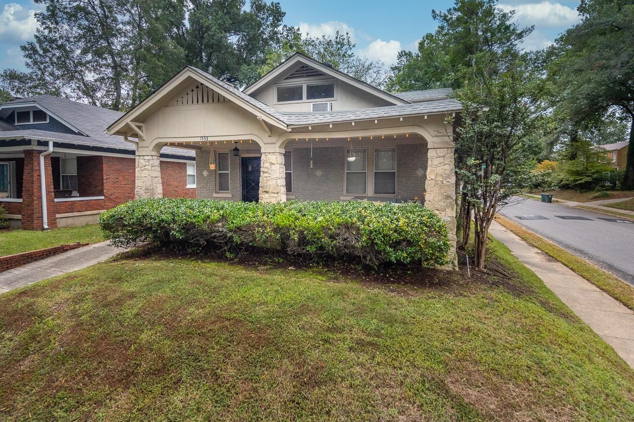 a front view of a house with garden