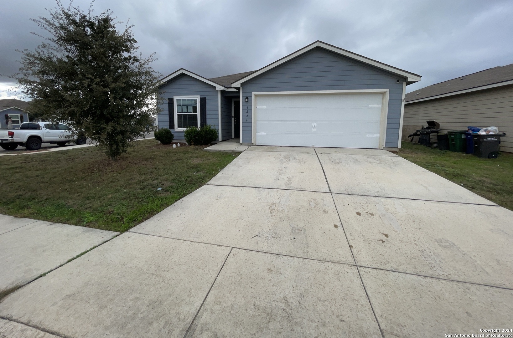 a view of garage and yard