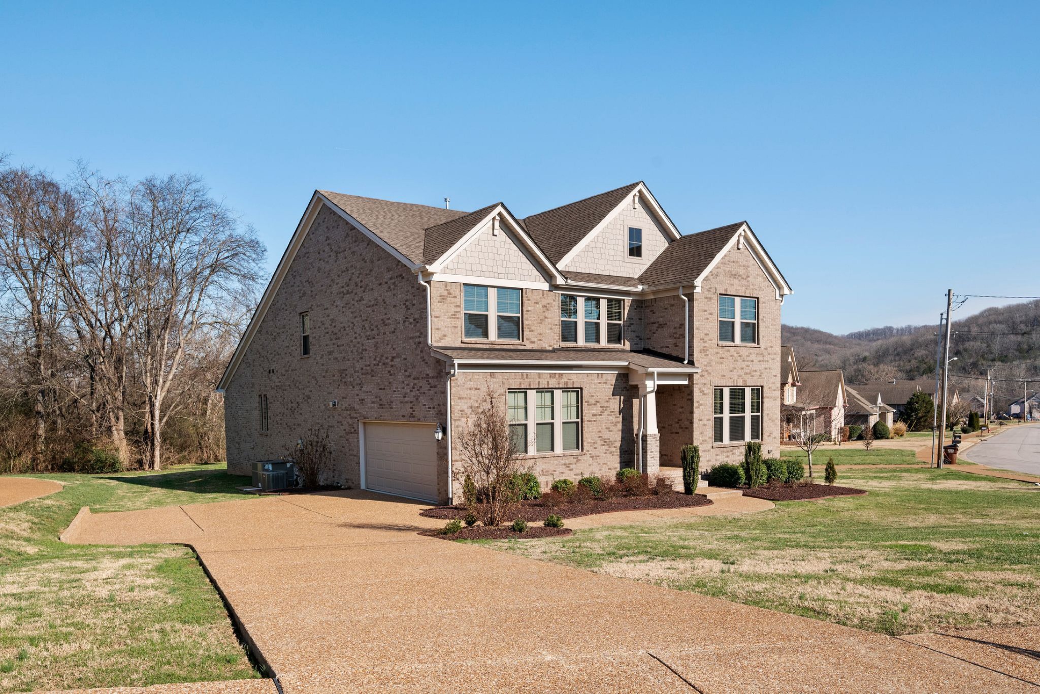 a front view of a house with a yard