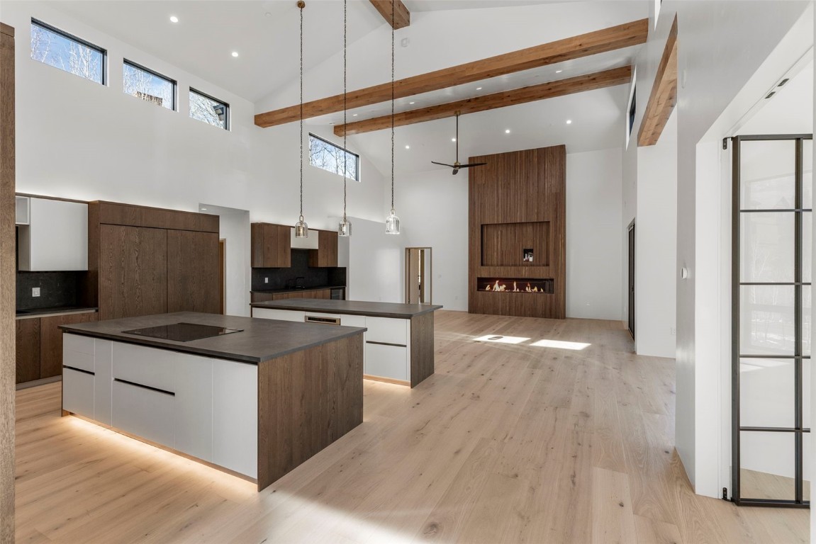 a kitchen with stainless steel appliances granite countertop a refrigerator and a stove