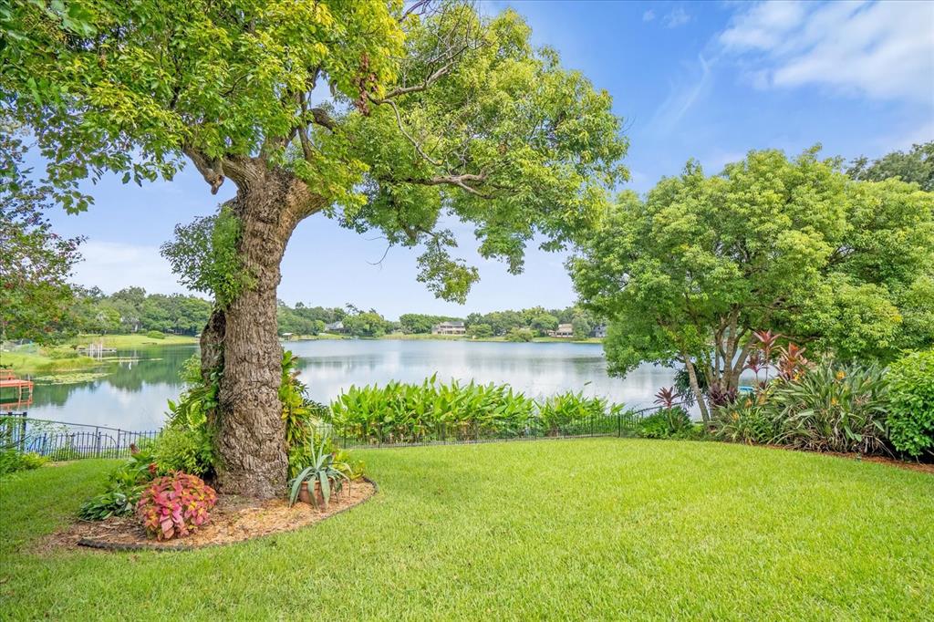 a view of a lake with a house in the background