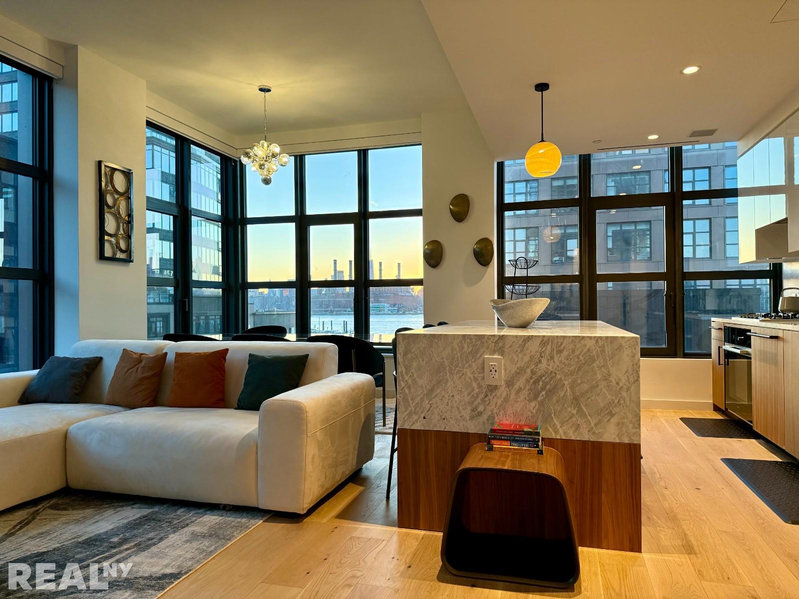 a living room with furniture and large window