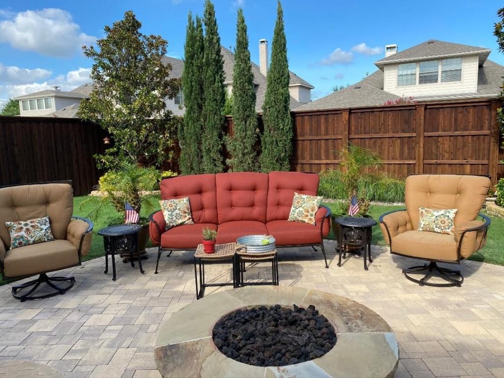 a outdoor living space with furniture and a rug