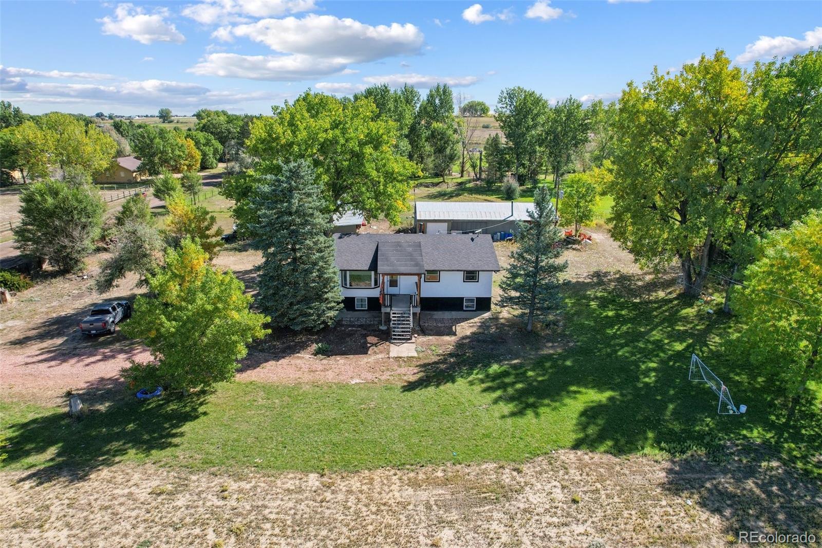 a view of a house with a yard and plants