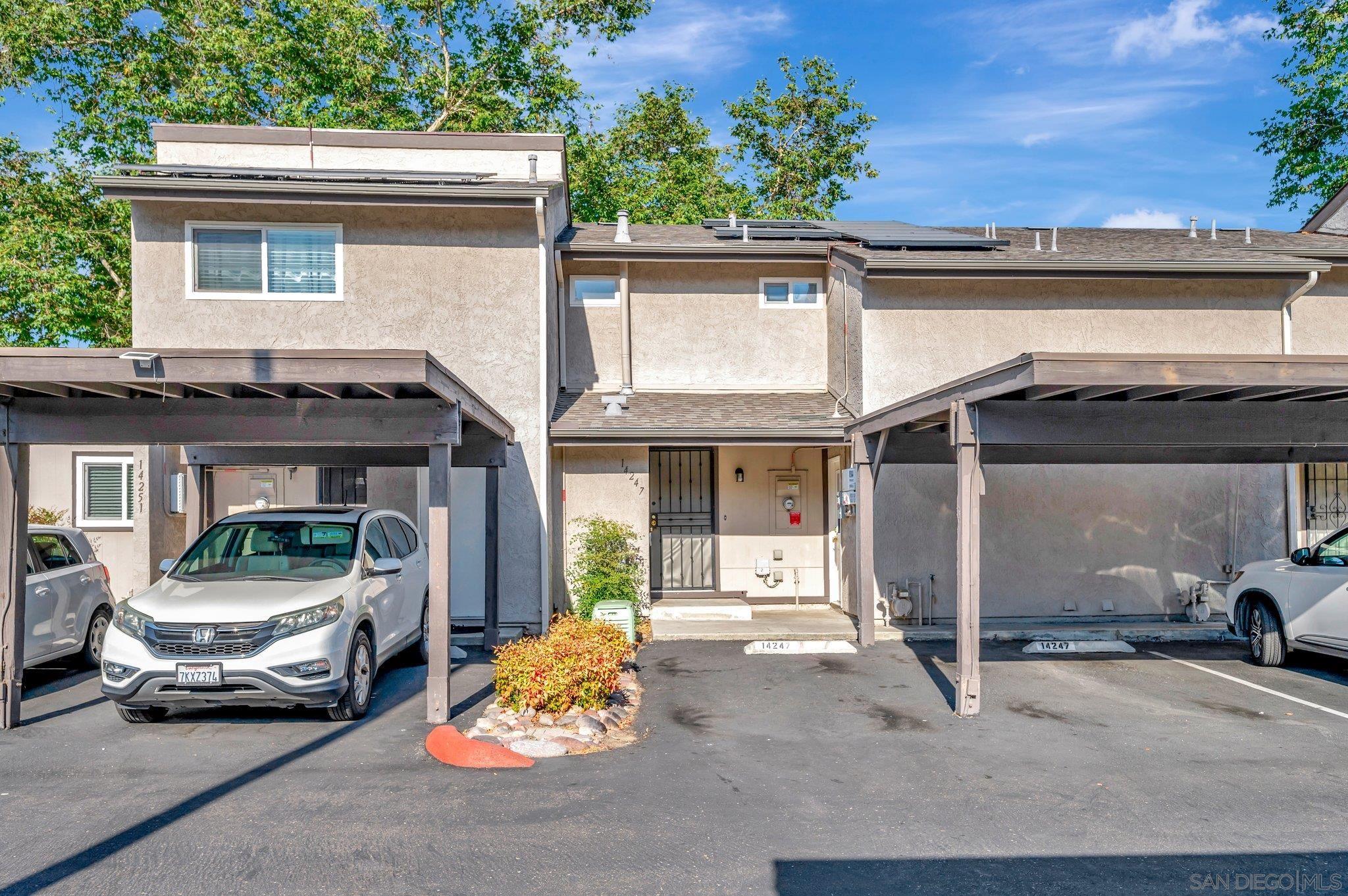 a view of a car park in front of house