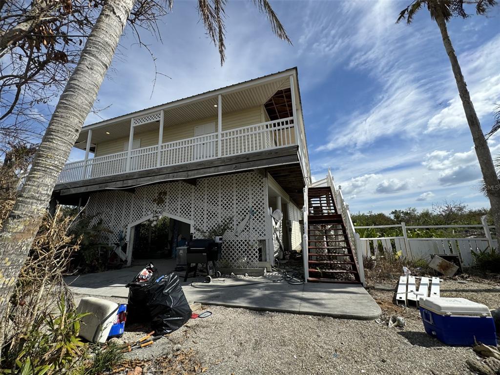 a front view of a house with sitting area