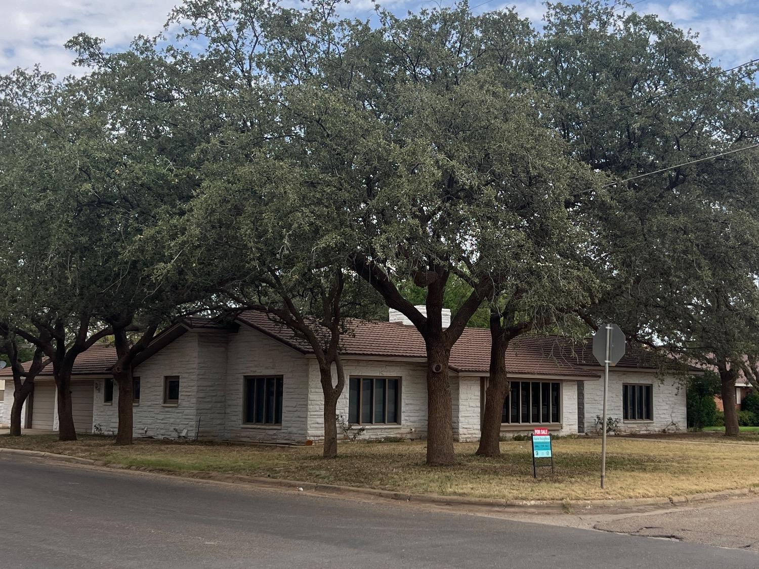 front view of a house with a street