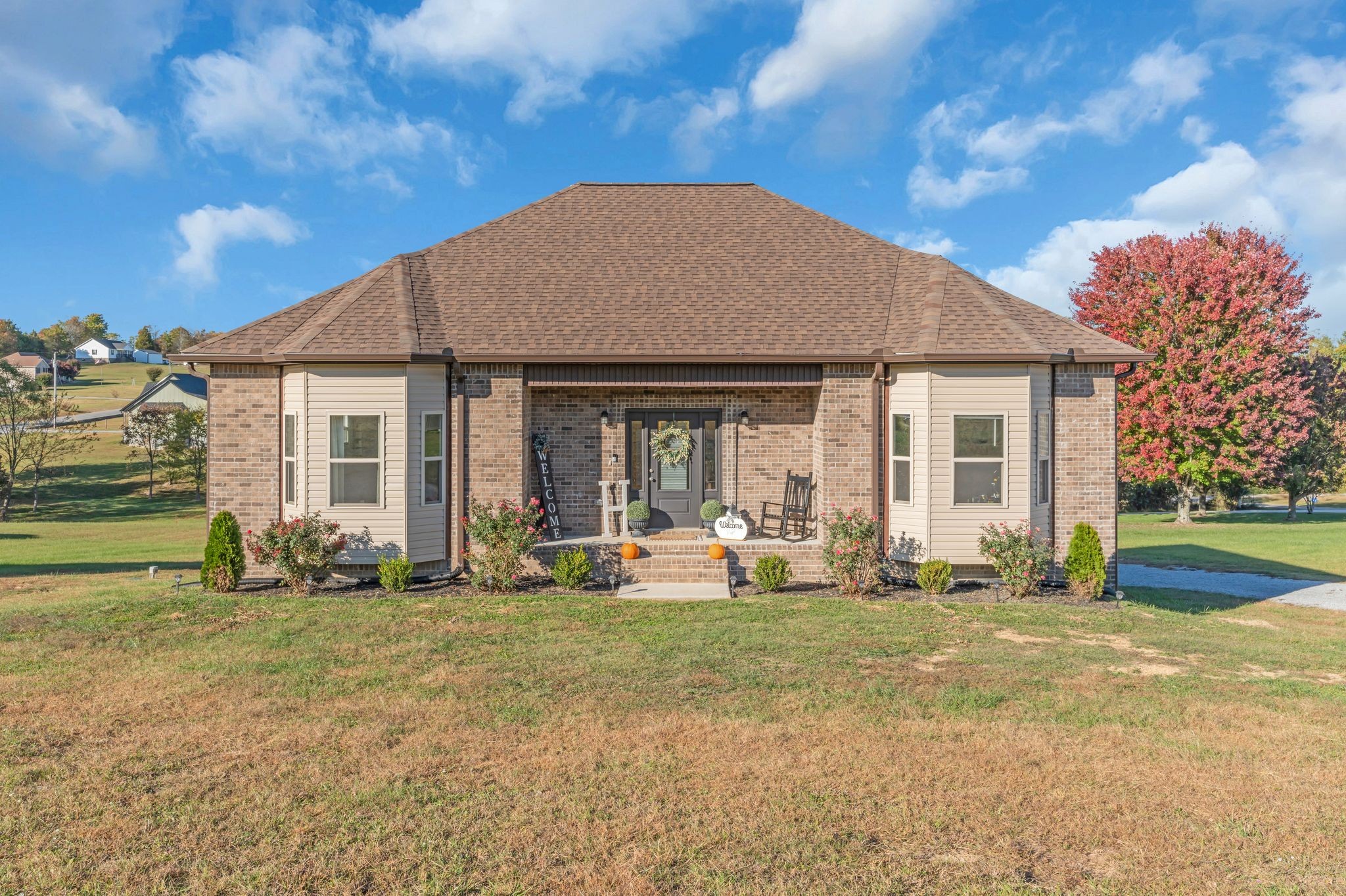 a front view of a house with a yard