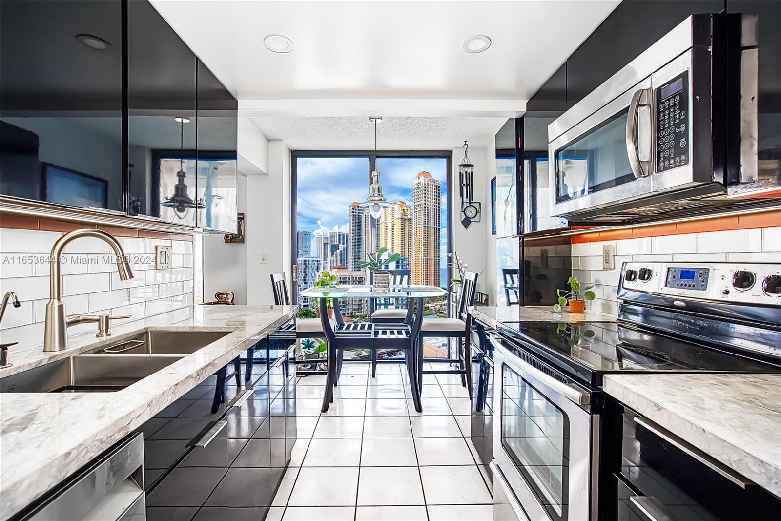 a kitchen with sink a stove and cabinets