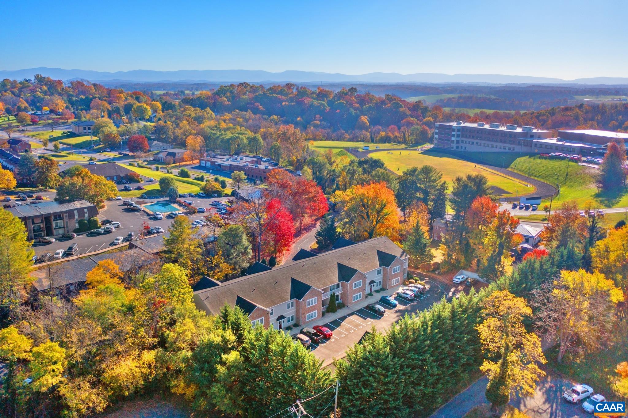 an aerial view of residential house with swimming pool and outdoor space