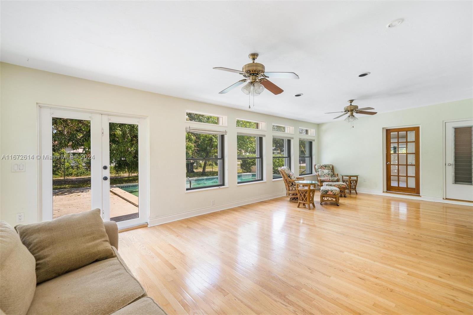 a living room with furniture and window with outer view