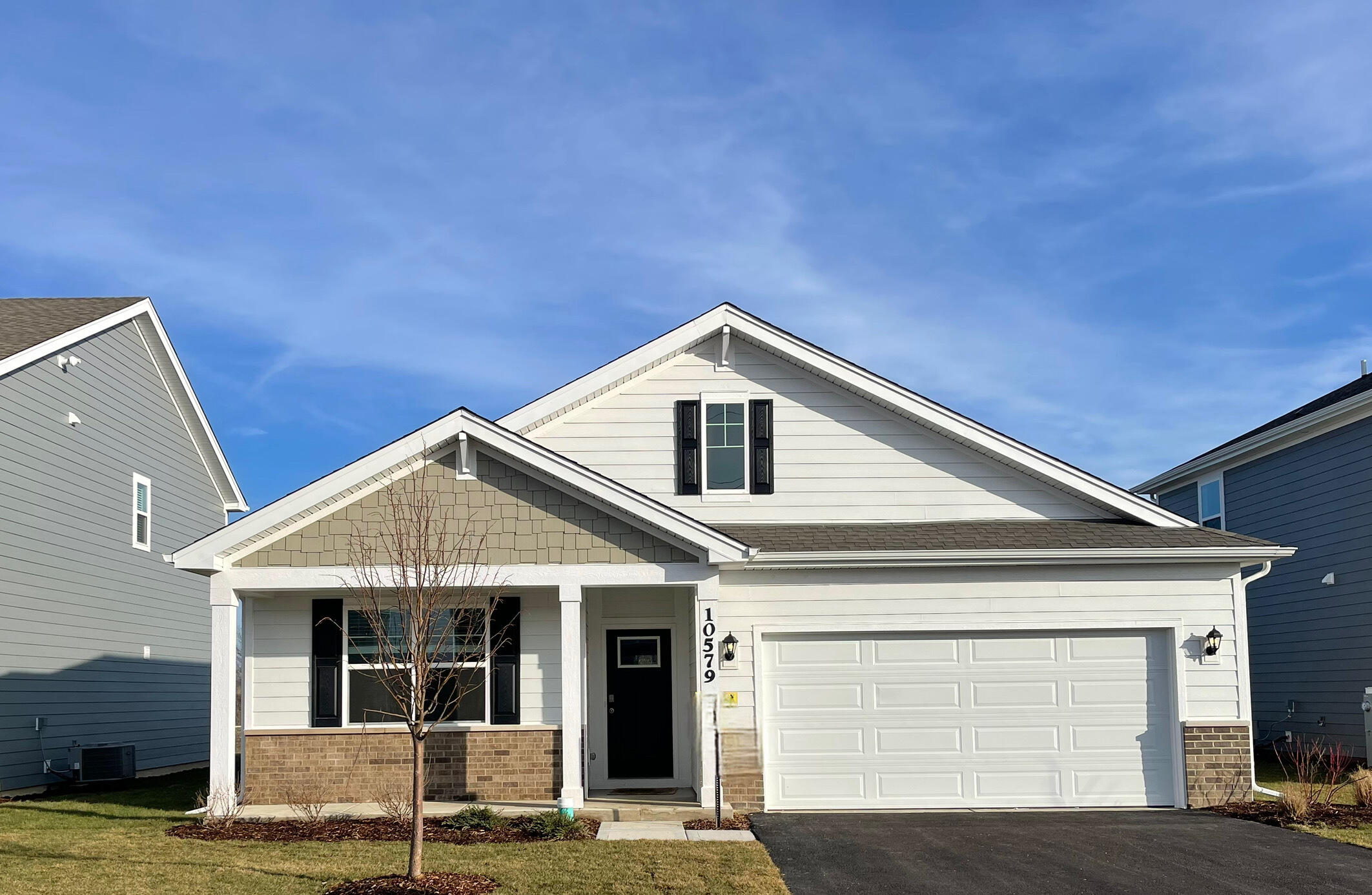 a front view of a house with garage