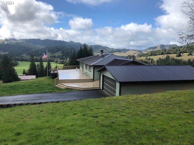 a view of house with yard and entertaining space