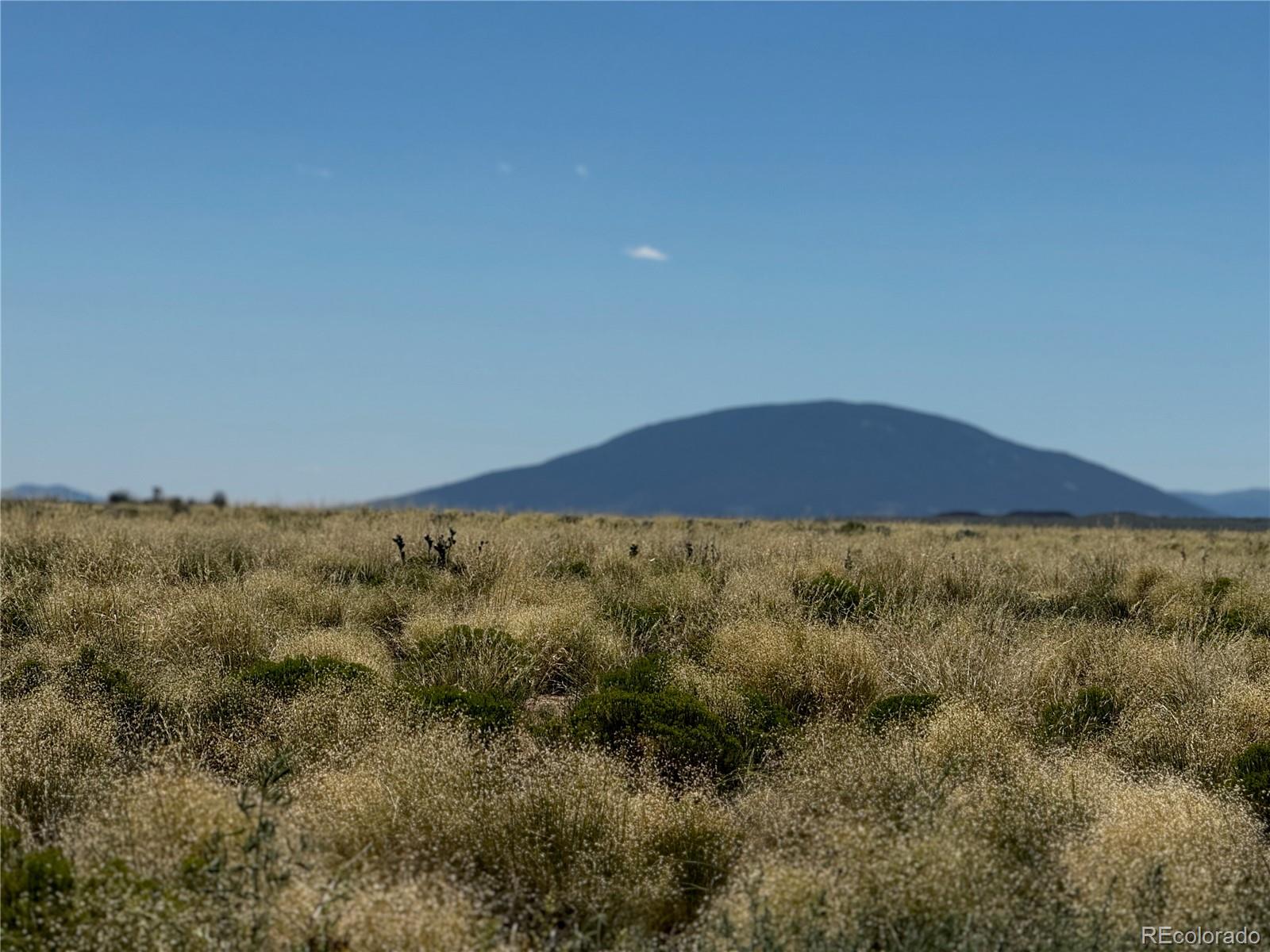 a view of an outdoor space and mountains