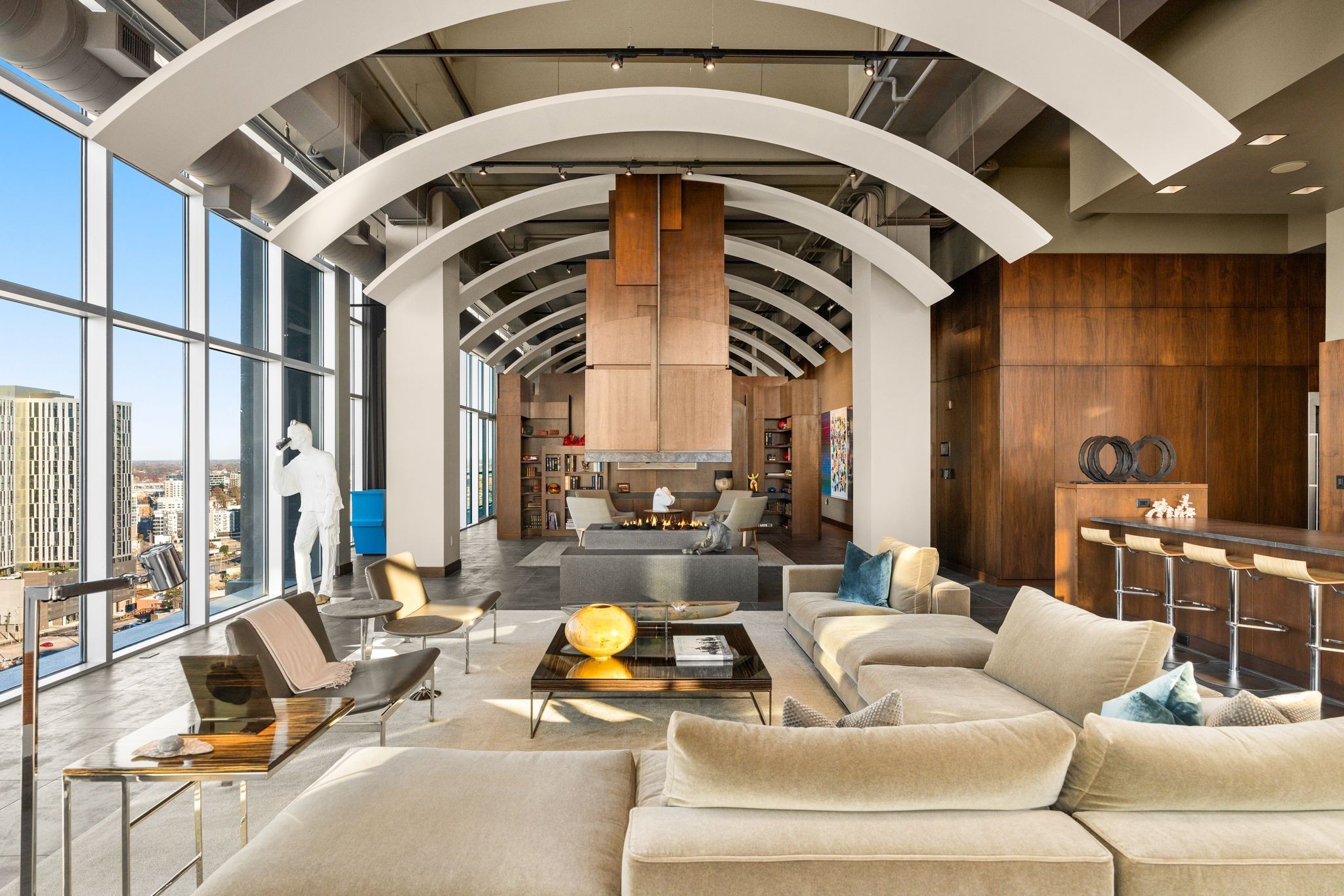 a view of living room with furniture and floor to ceiling window