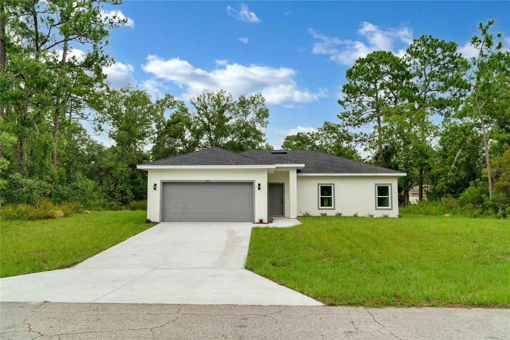 front view of a house with a yard