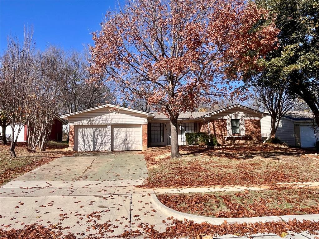 a front view of a house with a yard covered in snow