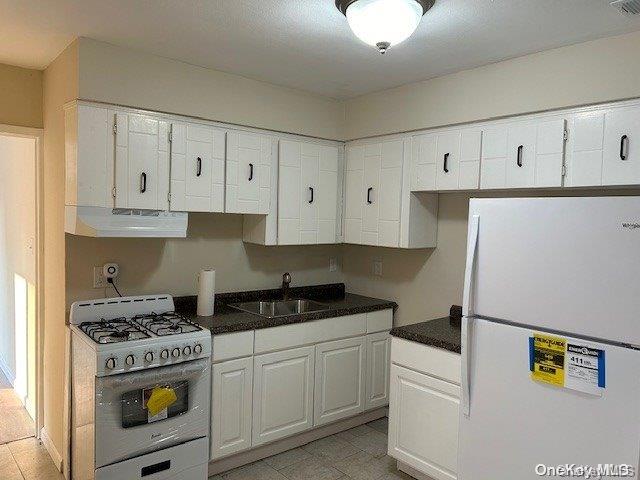 a kitchen with cabinets and appliances