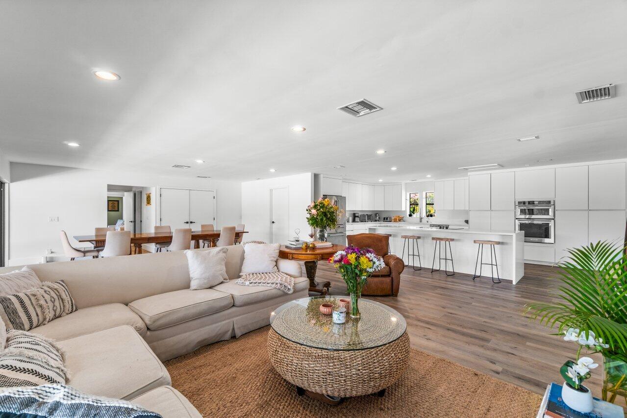 a living room with furniture kitchen and kitchen view