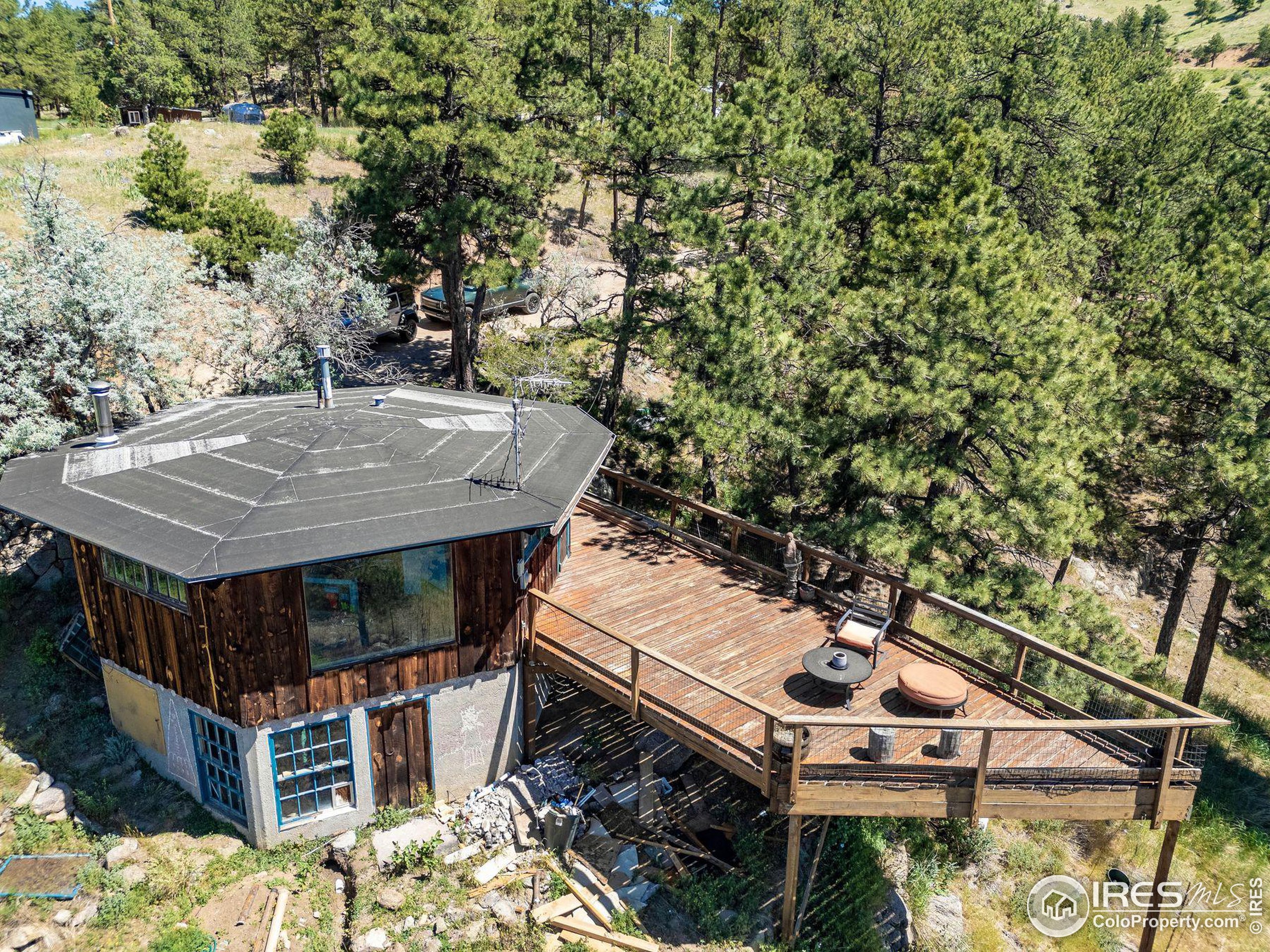 an aerial view of a house with swimming pool and sitting area