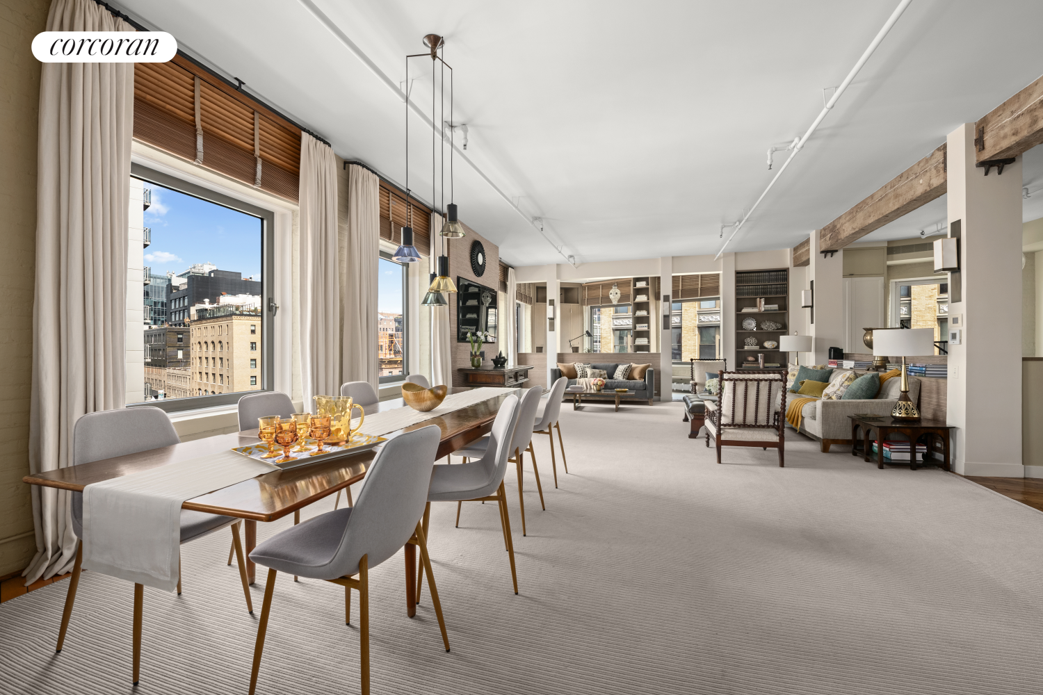 a dining room with furniture and a chandelier