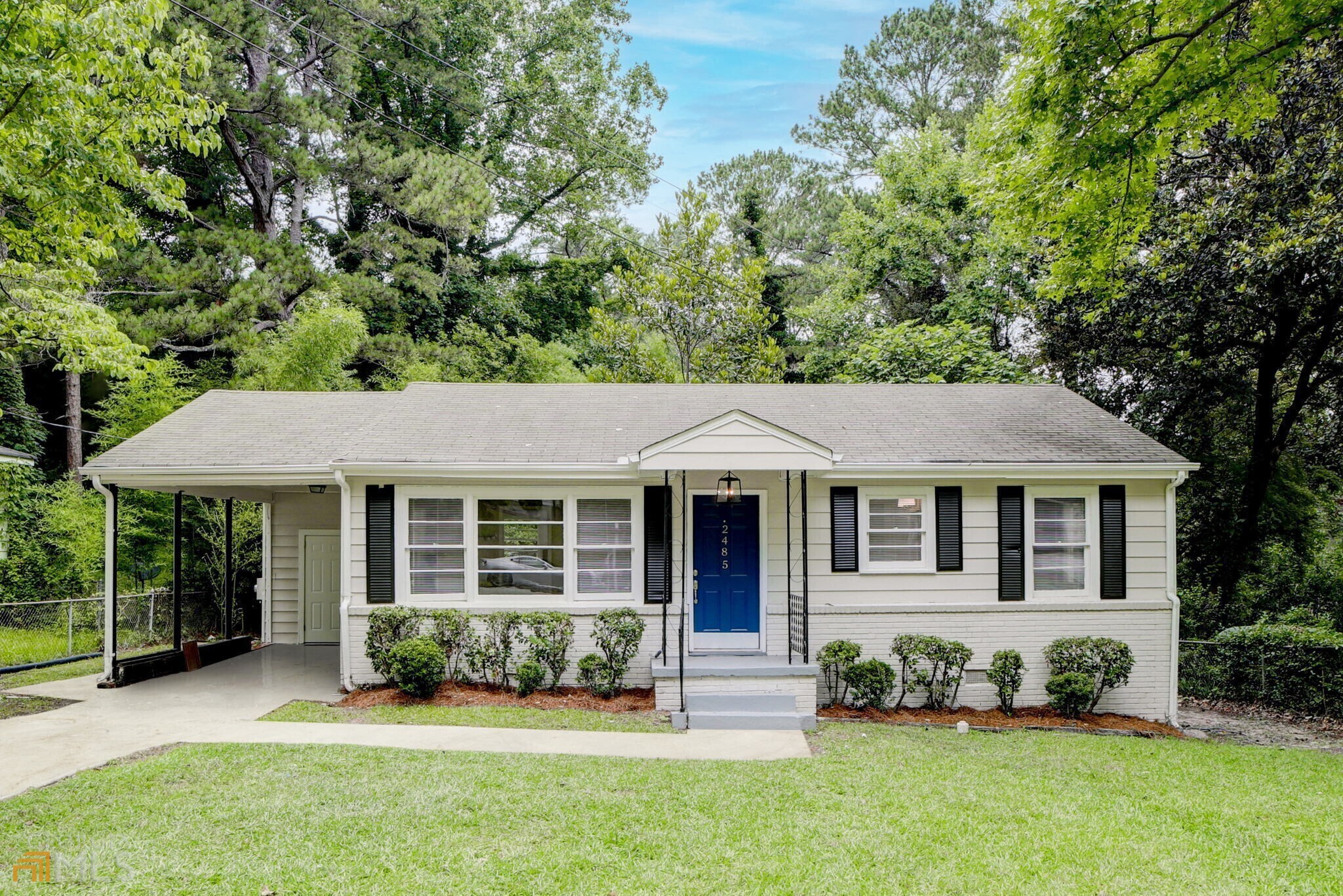 front view of a house with a yard