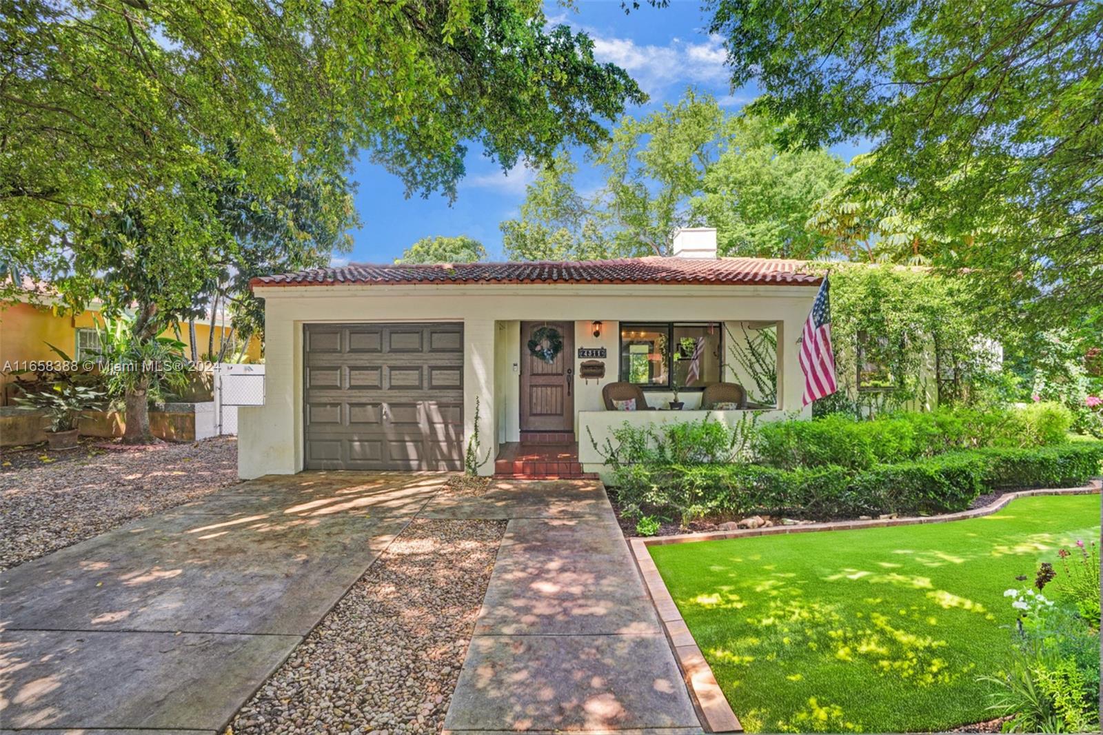 front view of a house with a yard