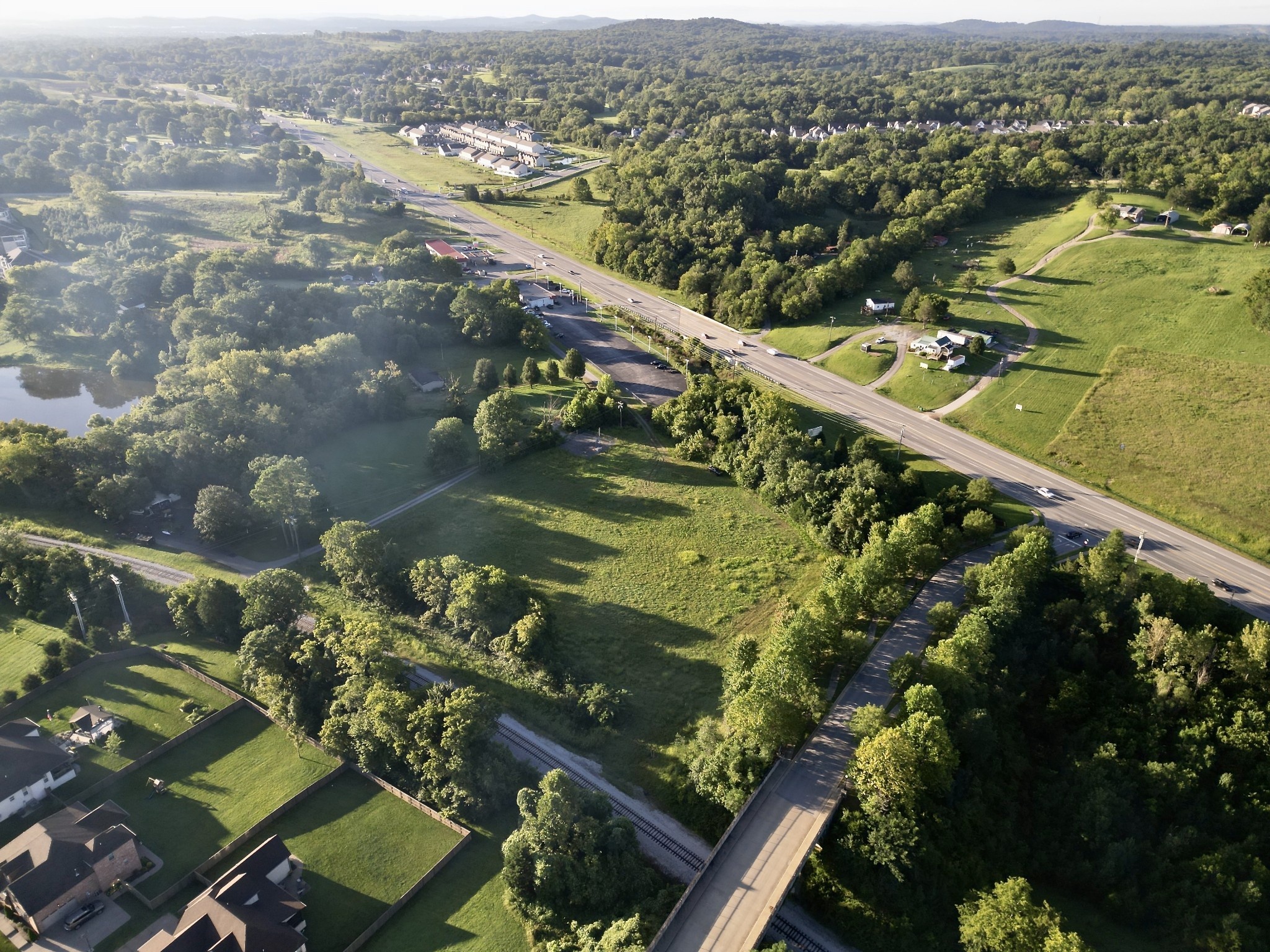 an aerial view of residential houses with outdoor space