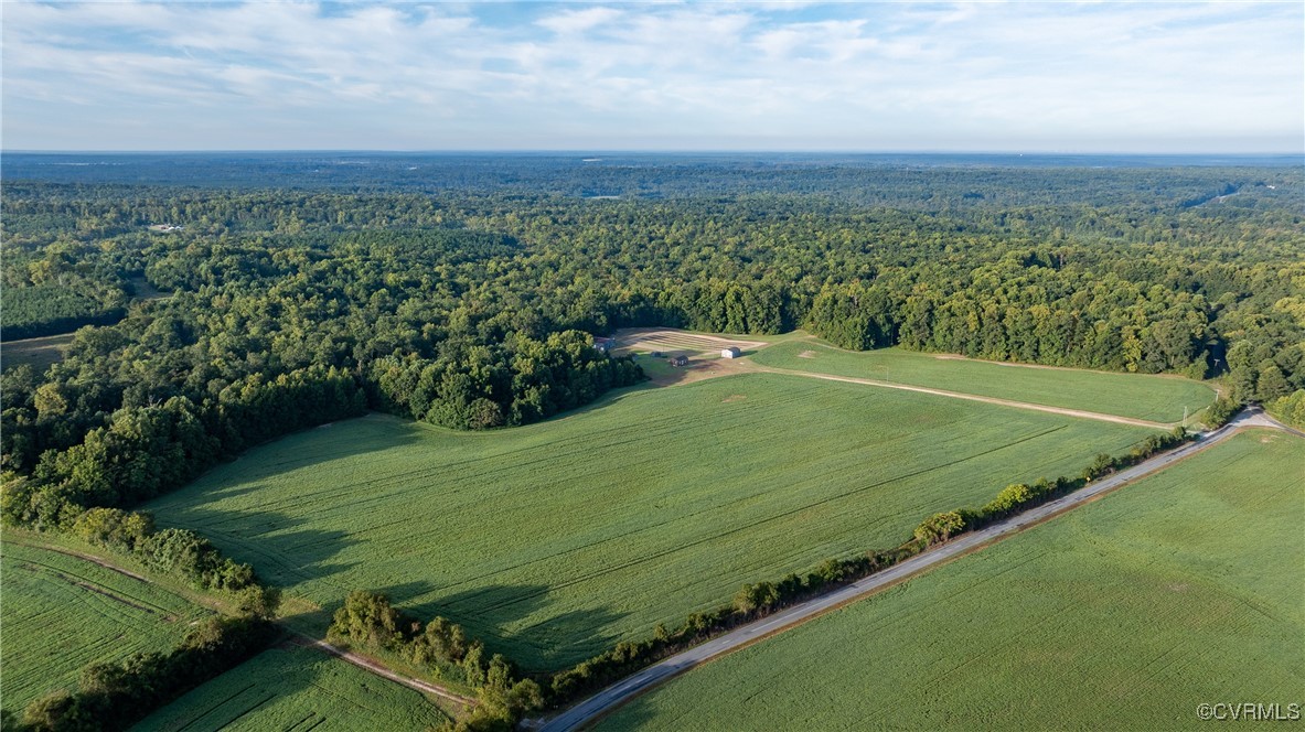 a view of a field with an ocean