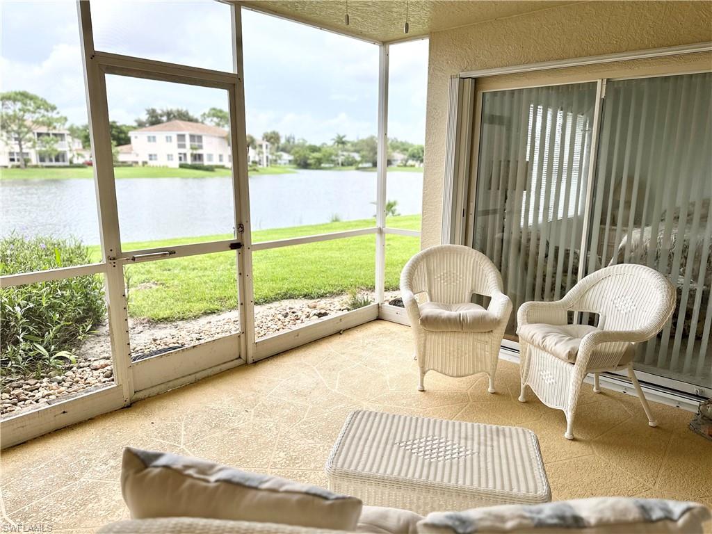 a living room with couch and a large window