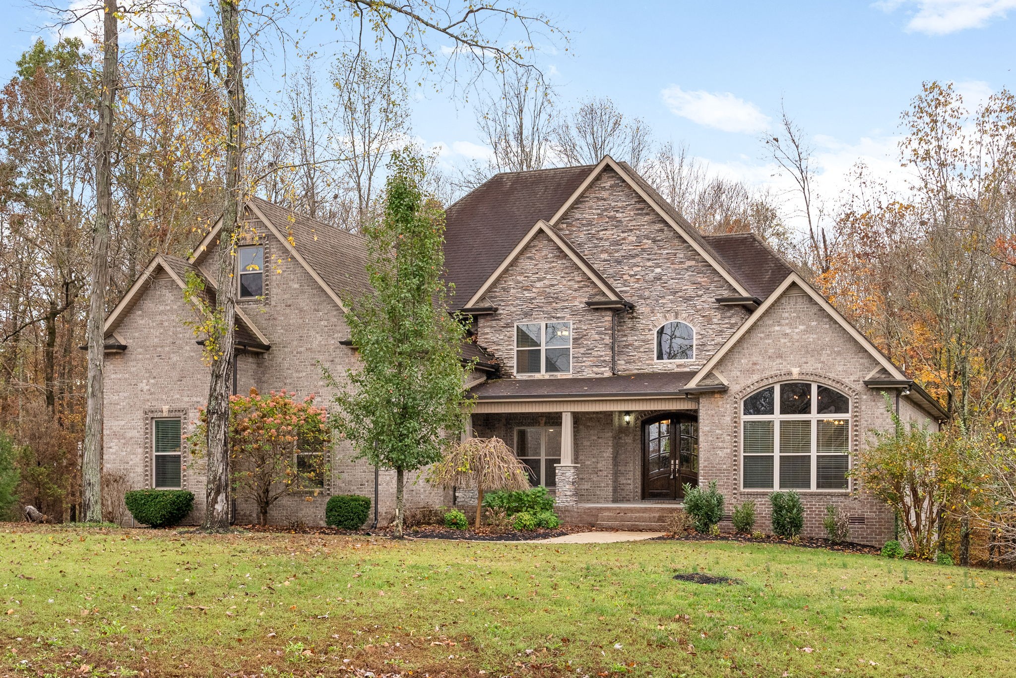 a front view of a house with a yard