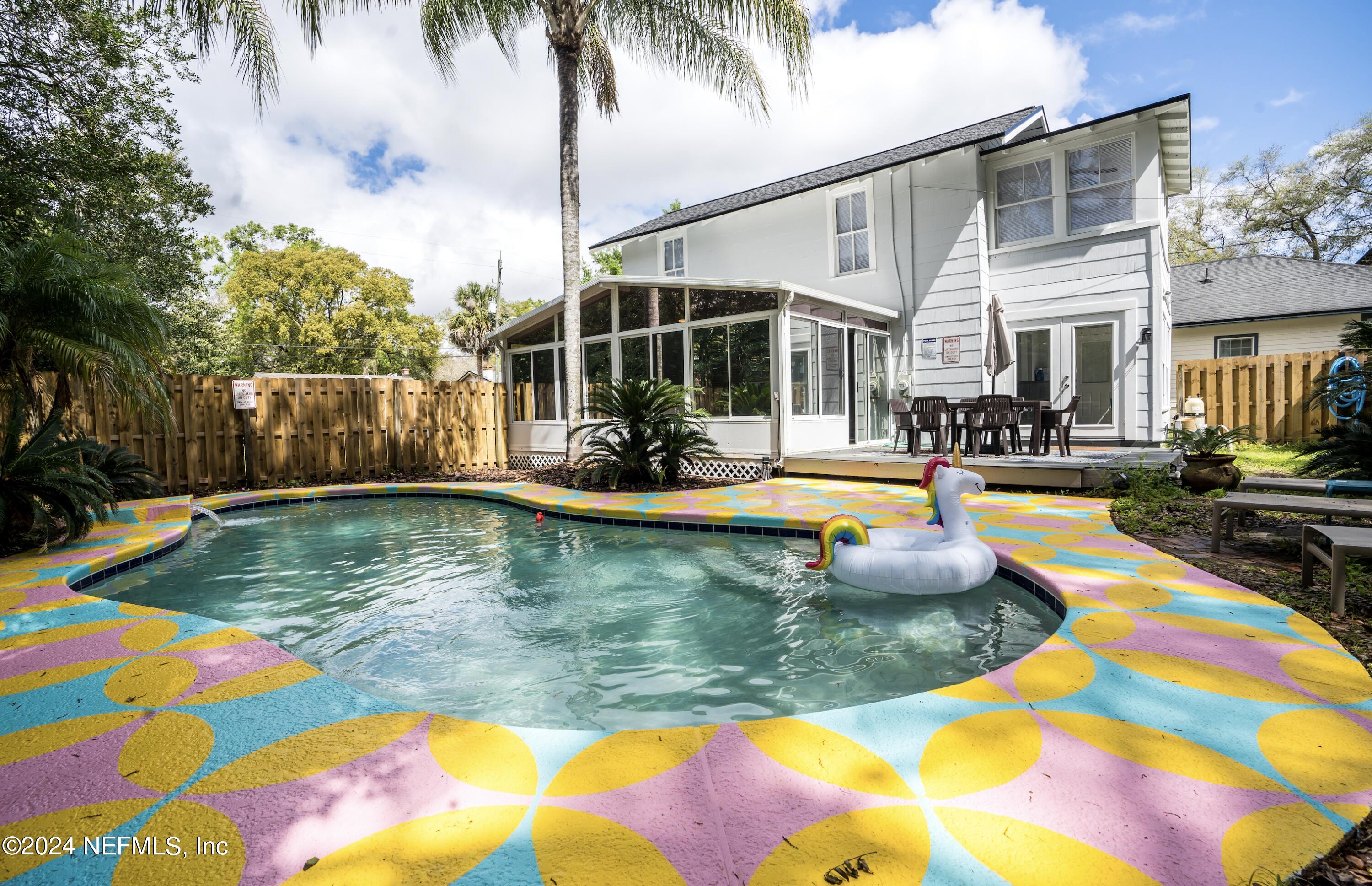 a view of swimming pool with seating space