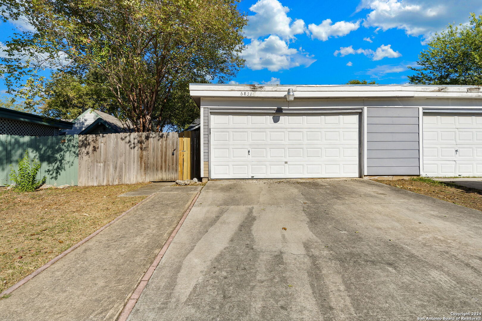 a view of backyard of a house