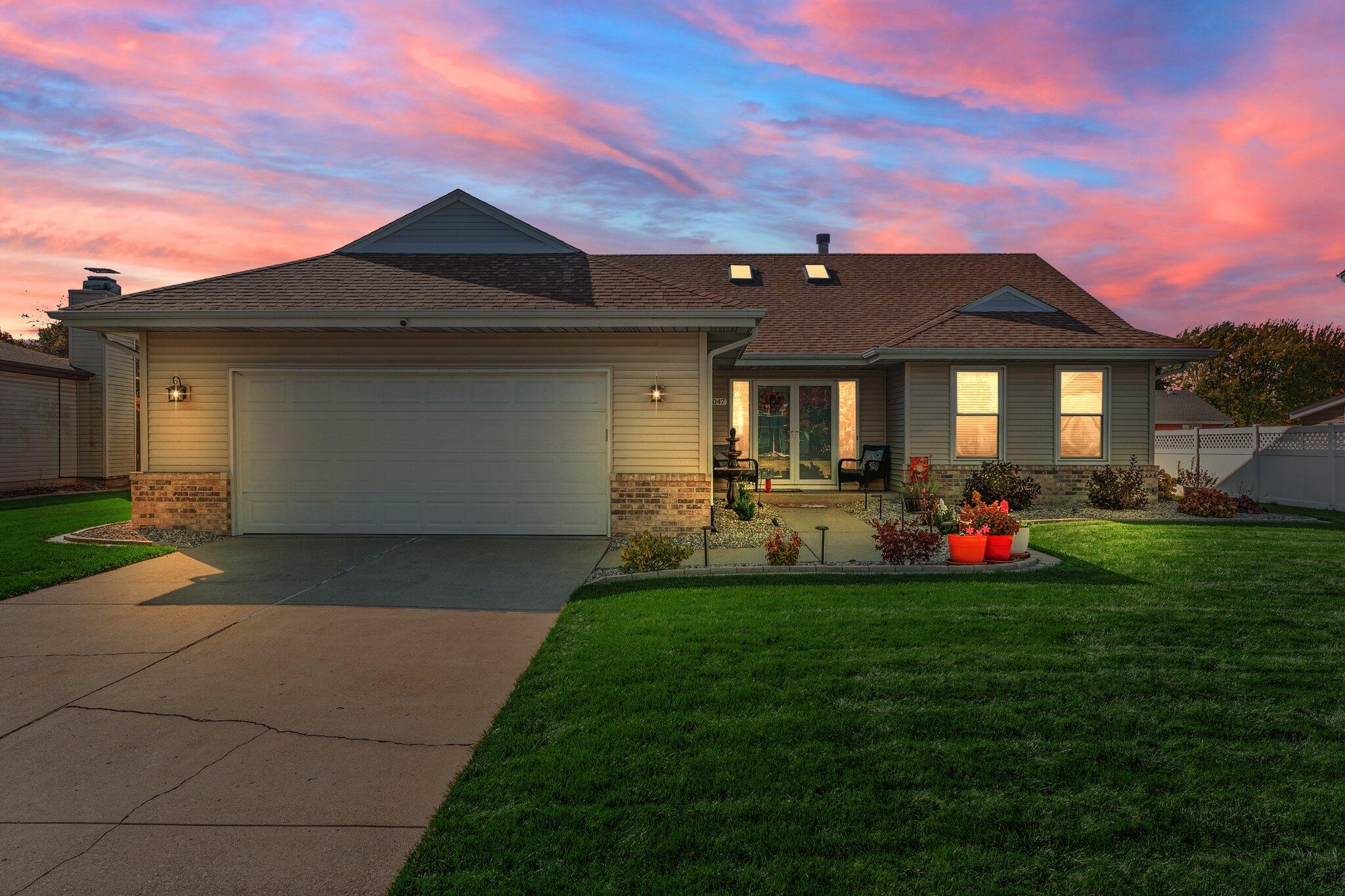 a front view of a house with many yard