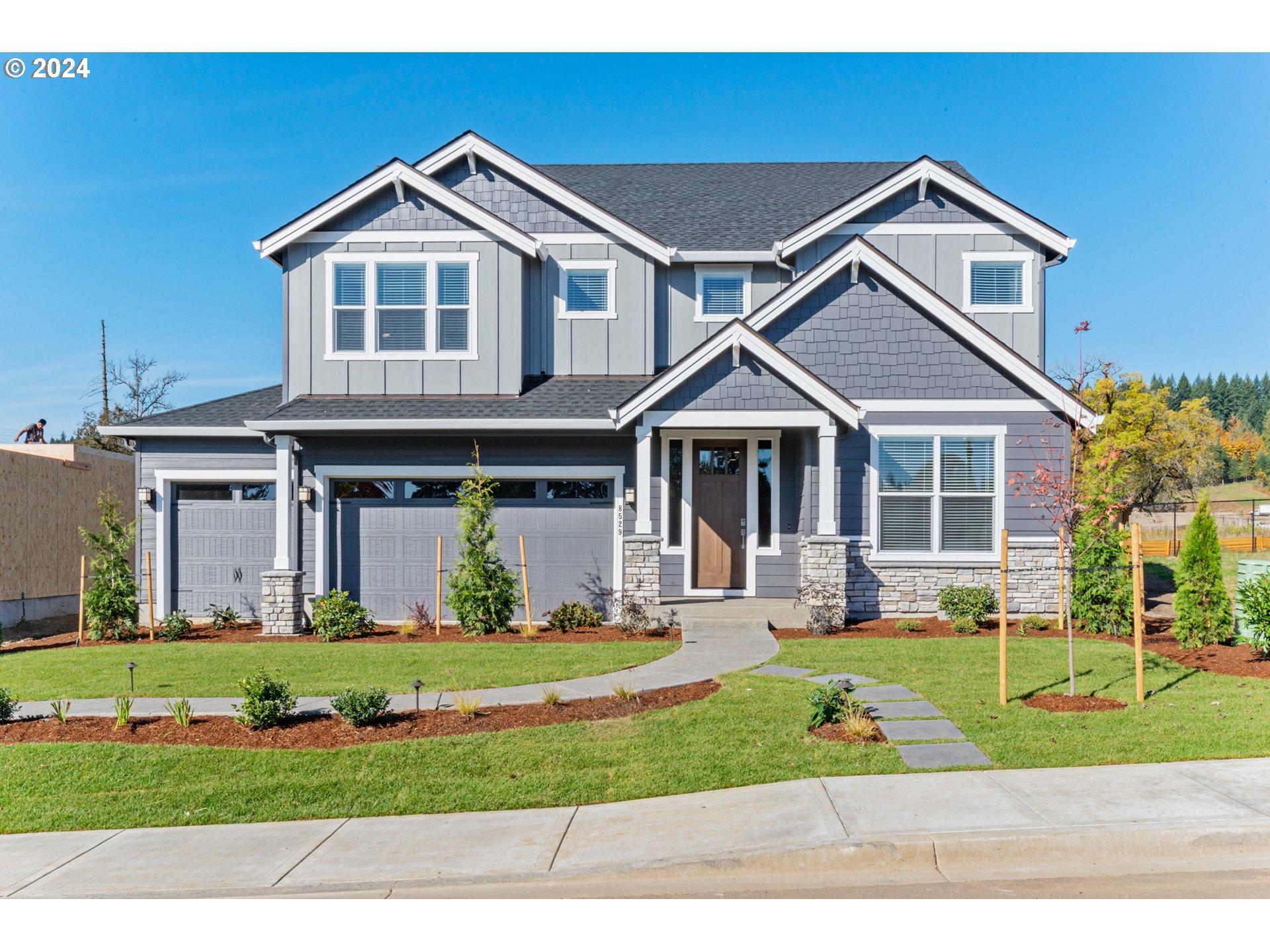 a front view of a house with a yard